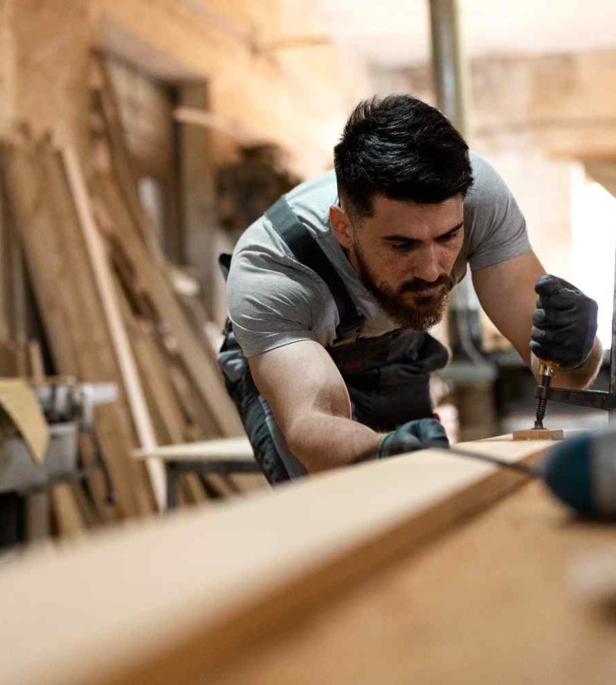 carpenter-cutting-mdf-board-inside-workshop1